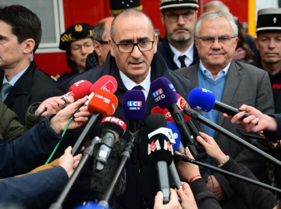 France's Interior Minister Laurent Nunez (C) speaks to the press at the site of an explosion in a residential building in Trevoux, central-eastern France, on December 16, 2025.