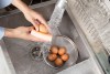 Before storing eggs, there is a step that can remove the shell's natural protection and expose them to bacteria.